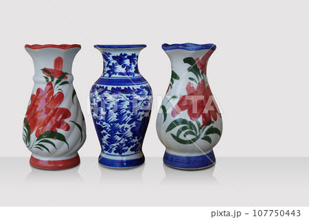 front view three ceramic vase on grey floor and white background, decor, retro, vintage, ancient, fashion, copy space front view three ceramic vase on grey floor and white background, decor, retro, vintage, ancient, fashion, copy space 107750443