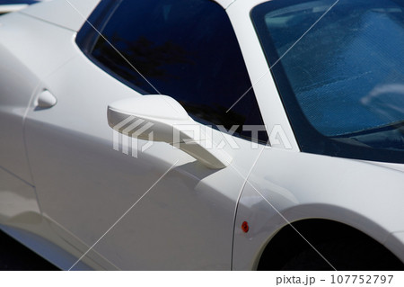 Close up of a white sport car parked in the marina. 107752797