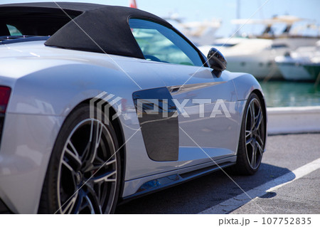 Luxury sports car on the background of yachts. 107752835
