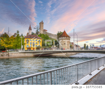 Outstanding historic city center of Lucerne with famous buildings and Nolliturm tower on Reuss river. Popular travel destination . Location Outstanding historic city center of Lucerne with famous buildings and Nolliturm tower on Reuss river. Popular travel destination . Location 107753385