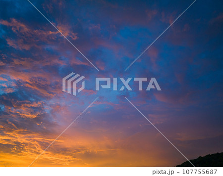 .amazing colorful orange cloud above the ocean in sunset 107755687