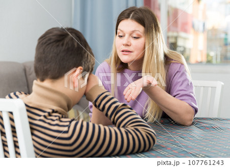 Offended boy and angry mother having quarrel at home 107761243