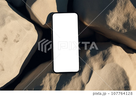 Flatlay phone on sand-colored stones. Free space for text, mockup Flatlay phone on sand-colored stones. Free space for text, mockup 107764128