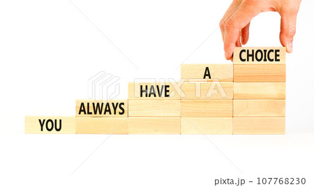 You always have choice symbol. Concept words You always have a choice on wooden block. Beautiful white table white background. Businessman hand. Business you always have choice concept. Copy space. You always have choice symbol. Concept words You always have a choice on wooden block. Beautiful white table white background. Businessman hand. Business you always have choice concept. Copy space. 107768230