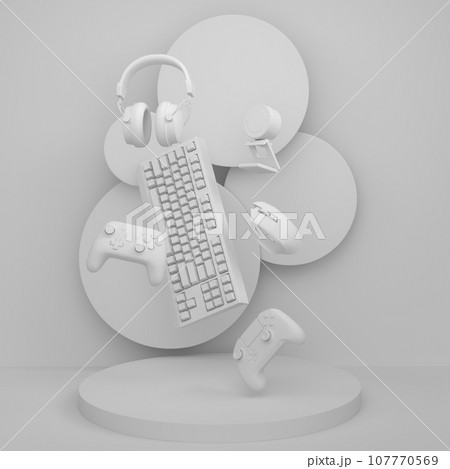 Set of video game joystick, keyboard and headphones on monochrome podium 107770569