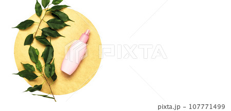 nature tropical green ficus leaf, cosmetic bottle, round isolated on white background. nature tropical green ficus leaf, cosmetic bottle, round isolated on white background. 107771499