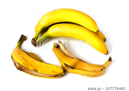 Bananas and banana peels on a white background. Bananas and banana peels on a white background. 107776462