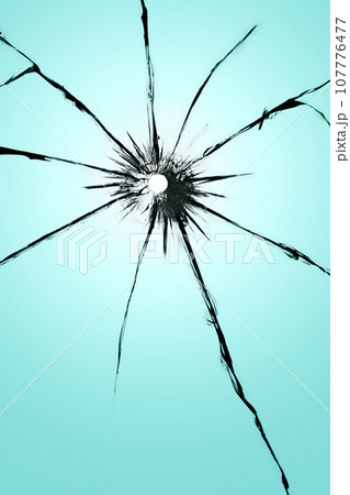 Cracked glass with a hole, broken window texture, bullet hole. Cracked glass with a hole, broken window texture, bullet hole. 107776477