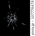 Cracked texture of broken glass on a black background. 107776478