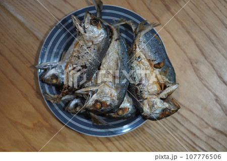top view Several fried mackerel Stacked on a ceramic plate. Place on the table background, fish, food, object, health, copy space 107776506
