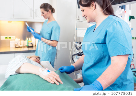 Nurses working in preparation of surgery Nurses working in preparation of surgery 107778035
