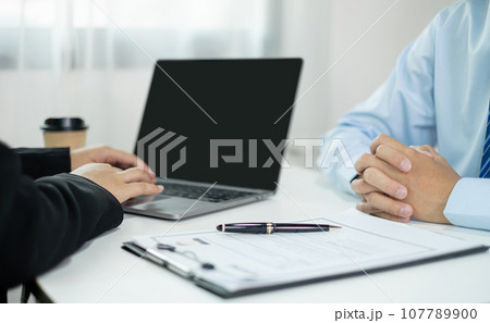 Business people hold a resume and talk to job applicants for job interviews about careers and Their personal history in the company. Recruitment concepts 107789900