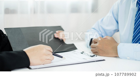 Business people hold a resume and talk to job applicants for job interviews about careers and Their personal history in the company. Recruitment concepts Business people hold a resume and talk to job applicants for job interviews about careers and Their personal history in the company. Recruitment concepts 107789902