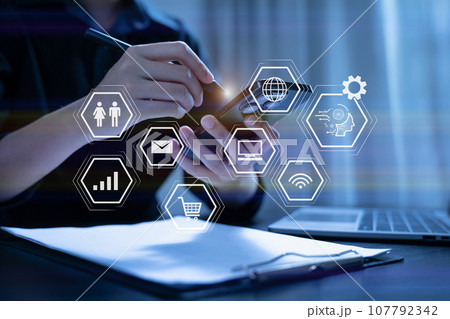 Digital transformation technology strategy, Person using laptop, tablet and smartphone with of things. transformation of ideas and the adoption. 107792342