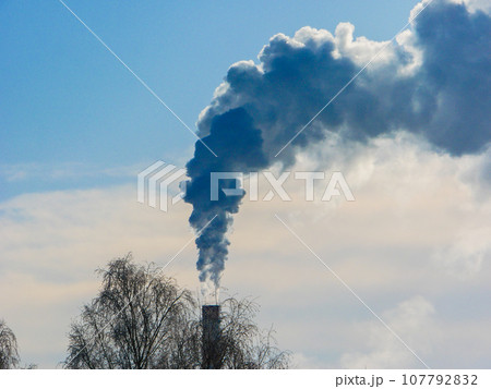 Chimney white smoke on a blue sky. Chimney white smoke on a blue sky. 107792832