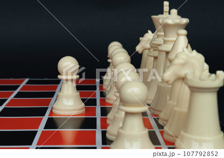 Selective view of chess pawn moving toward for battle. Strategy and tactic concept Selective view of chess pawn moving toward for battle. Strategy and tactic concept 107792852
