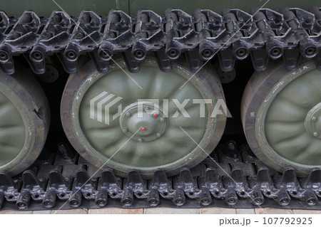 close up of old military tank wheel on caterpillar tracks. 107792925