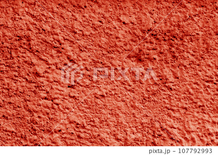 Red concrete wall on the street. 107792993