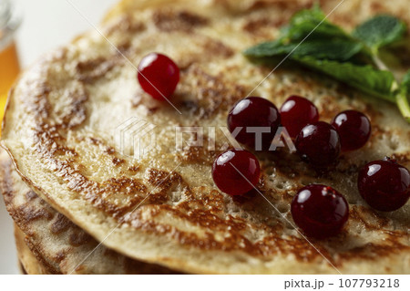 Large pancakes on light stone background Large pancakes on light stone background 107793218