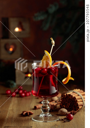 Christmas drink with spices, orange, and cranberries. 107793548