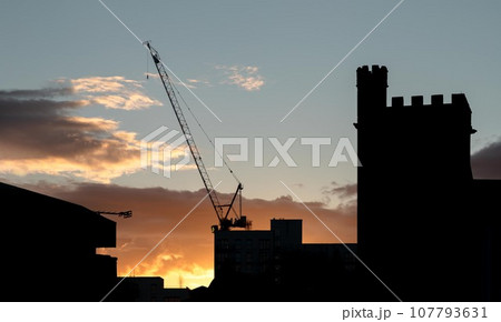 Silhouettes view of building construction with tower crane and house . 107793631