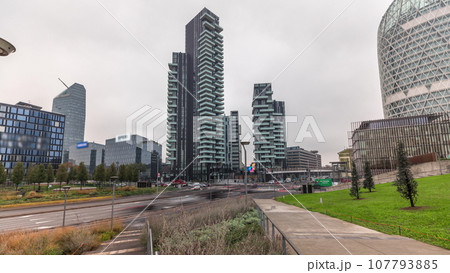 Panorama showing skyscrapers and biblioteca from park with green lawn timelapse in Milan Panorama showing skyscrapers and biblioteca from park with green lawn timelapse in Milan 107793885