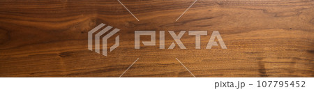 Real long american black walnut honey color texture after exposure to the sun for 3 years with oil finish 107795452