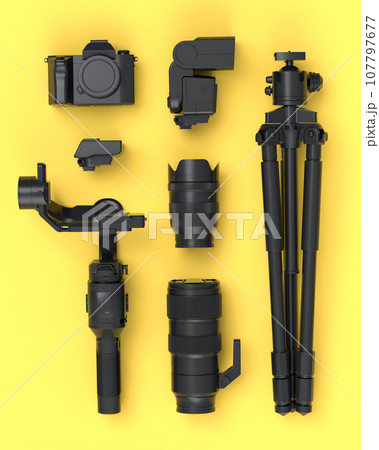 Top view of monochrome designer workspace and photography gear on yellow 107797677