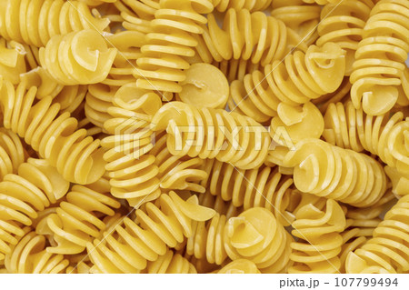 Background from Pasta. Fusilli spirale texture. Background from Pasta. Fusilli spirale texture. 107799494