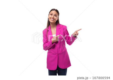 young well-groomed slender woman with black straight hair dressed in a crimson jacket holds her 107800594