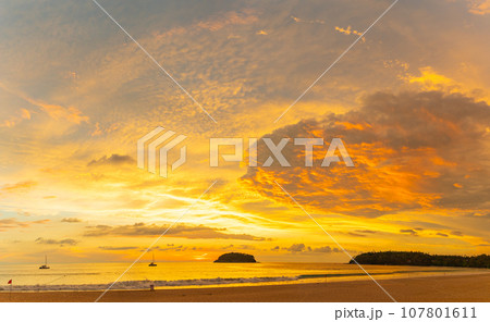 .beautiful cloud in golden sky at sunset in Kata beach Phuket Thailand. .beautiful cloud in golden sky at sunset in Kata beach Phuket Thailand. 107801611