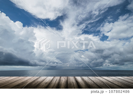 Dark clouds in open ocean 107802486