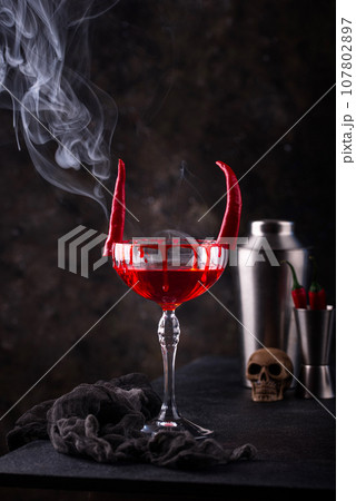 Halloween cocktail Red Devil martini 107802897