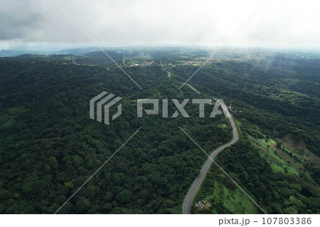 Green hills with mountain road Green hills with mountain road 107803386