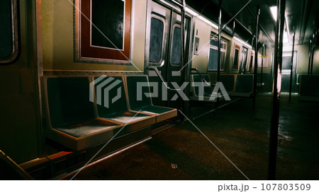 An empty subway car in a dimly lit metro station 107803509