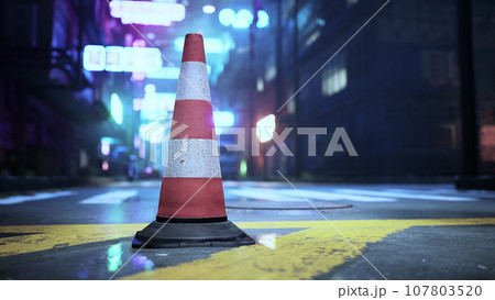 A traffic cone sitting on the side of a road 107803520
