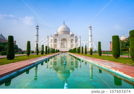 White domes and white towers under blue sky and white clouds. White domes and white towers under blue sky and white clouds. 107803874