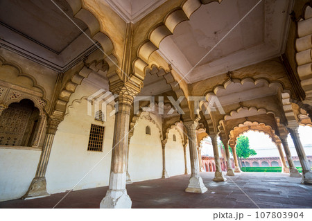 White and gold arches outside the Red Fort Palace in India. 107803904