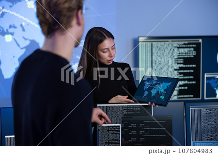 Cyber security team working in a Cyber Security Operations Center SOC to protect systems and technologies 107804983