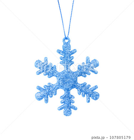 Hanging blue snowflake. Christmas tree ornament isolated on a white background. Stock photo Hanging blue snowflake. Christmas tree ornament isolated on a white background. Stock photo 107805179