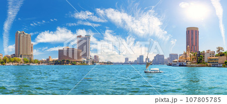 The Nile river view with boats and luxury hotels in the downtown of Cairo,  Egypt The Nile river view with boats and luxury hotels in the downtown of Cairo,  Egypt 107805785