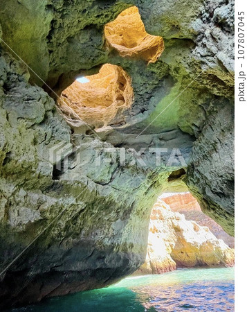 Beautiful view of Benagil Cave in Carvoeiro Algarve Portugal Beautiful view of Benagil Cave in Carvoeiro Algarve Portugal 107807045