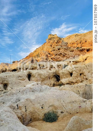 Reef formation from sandstone on the coast.Algar Seco, Carvoeiro. 107807969