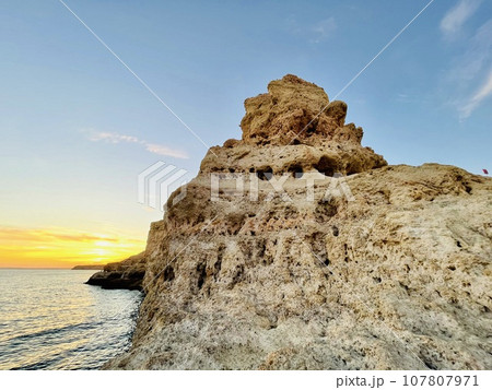Reef formation from sandstone on the coast.Algar Seco, Carvoeiro. 107807971