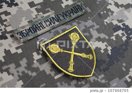 KYIV, UKRAINE - October 6, 2022. Russian invasion in Ukraine 2022. Ukraine Army Commander in Chief of the Armed Forces of Ukraine uniform badge. Text in Ukrainian - Armed Forces of Ukraine. KYIV, UKRAINE - October 6, 2022. Russian invasion in Ukraine 2022. Ukraine Army Commander in Chief of the Armed Forces of Ukraine uniform badge. Text in Ukrainian - Armed Forces of Ukraine. 107808705