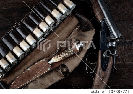 12-gauge break-action smooth-bored shotgun with paper cases. 107808721