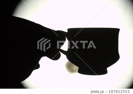 Cup in a hand Cup in a hand 107812555