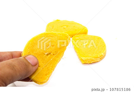 Gram flour sweets on white background with selective focus Gram flour sweets on white background with selective focus 107815186
