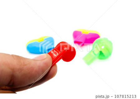 Toy Whistle on white background with selective focus 107815213