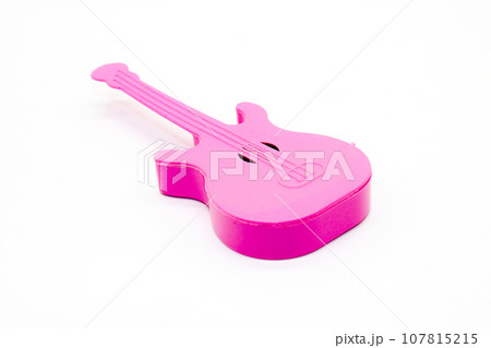 Toy guitar on white background with selective focus 107815215